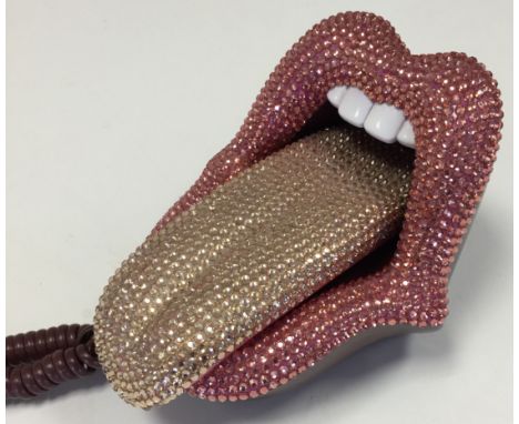 ROLLING STONES TELEPHONE. A novelty telephone in the style of the Rolling Stones tongue design.