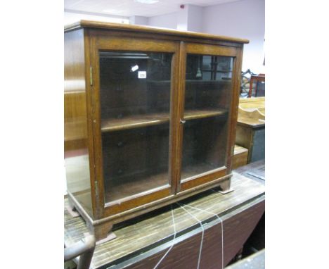 Oak Small Cabinet with twin glazed doors on bracket feet, 78.5cm wide. 