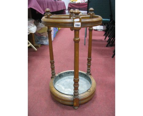 Early XX Century Oak Stick Stand of Circular Form, with three dividers, turned supports and galvanized drip tray. 