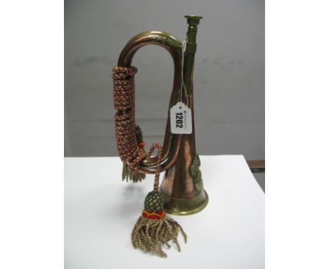 A Copper and Brass Bugle, with Royal Welsh Fusiliers badge attached numbered 23.