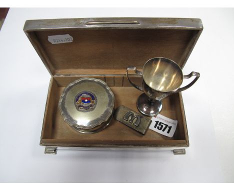 A Hallmarked Silver Cigarette Box, engine turned, on bracket feet, 16cm wide, a miniature twin handled trophy cup, "Aberdeen 