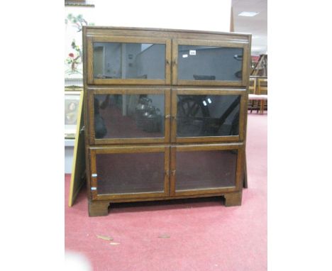 Oak Three Sectional Bookcase in The Globe Wernicke style, with twin glazed doors to each piece, on bracket feet, 89cm wide. 