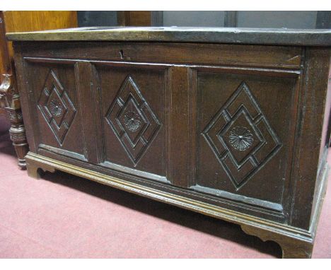 A XVII Century Jointed Oak Blanket Box, with panelled top, three panelled base, with lozenge decoration on later bracket feet