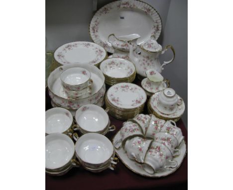 A Royal Albert/Paragon Dinner Service in the Victoriana Rose Pattern, comprising twelve dinner plates, oval meat plate, two v