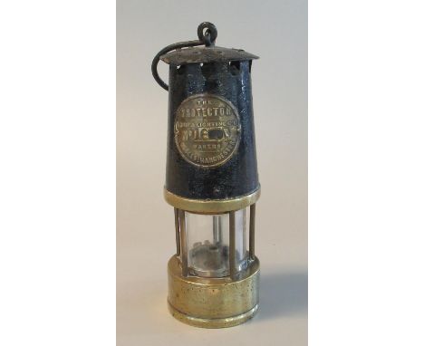 The Protector Lamp & Lighting co. of Eccles, Manchester brass miners safety lamp in used condition.(B.P. 21% + VAT) 