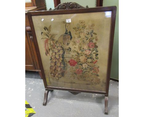 Early 20th century mahogany framed tapestry fire screen depicting a peacock amongst foliage.(B.P. 21% + VAT) 70x103cm approx.