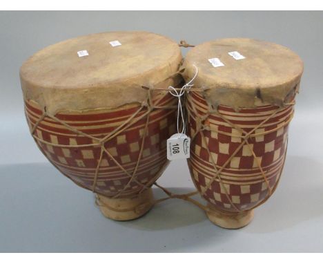 Pair of ceramic velum covered string mounted tom tom drums.(B.P. 21 + VAT) 