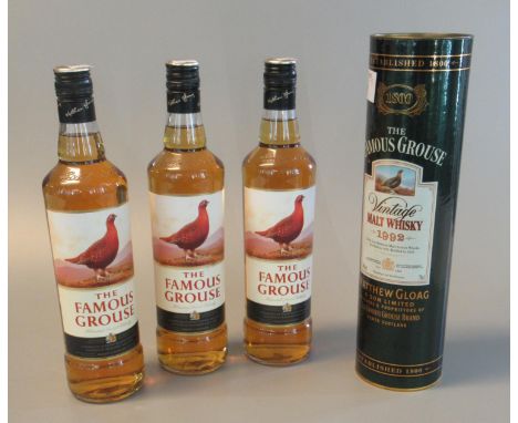 Three bottles of The Famous Grouse blended scotch whisky. 70cl, 40% vol. Together with The Famous Grouse vintage malt whisky 