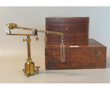 Gilded brass Westphal scientific balance with weights and accessories in a fitted wooden box. Incomplete. Together with a mah
