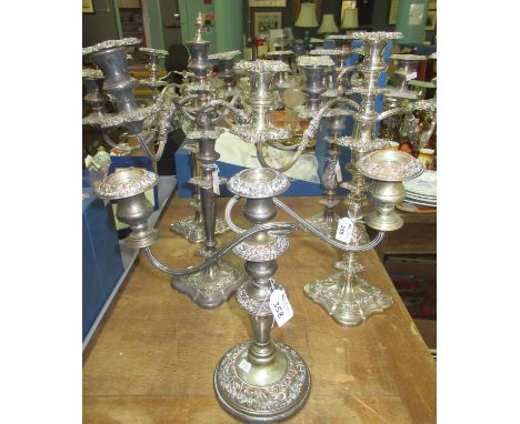 Five heavy white metal candelabra with various relief decoration, one silver plate on copper, Art Nouveau style candelabrum, 