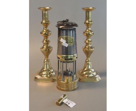 Pair of brass baluster candlesticks, 32 cm high approx. Together with a small cylindrical brass cigarette lighter marked ULMF