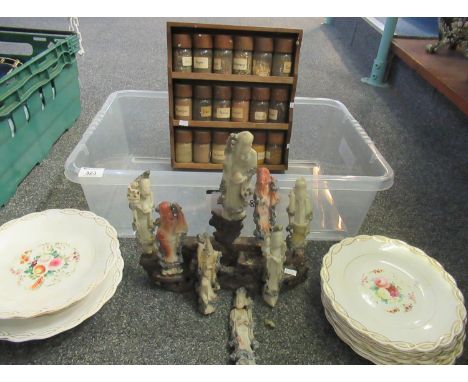 Box containing Chinese carved soapstone and rock deities/immortals with a carved hardstone stand, together with a spice rack 