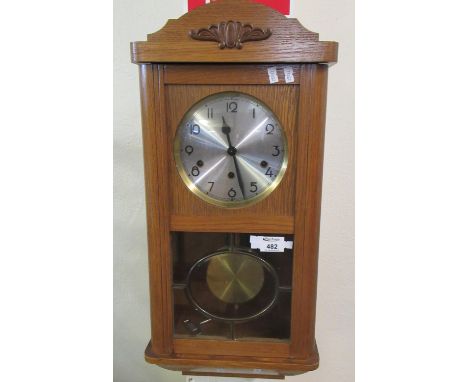 Mid century German three-train oak cased wall clock with key and pendulum.(B.P. 21% + VAT) 