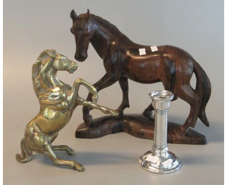 Carved hardwood study of a horse, 20 cm long approx. Together with a very heavy cast brass horse, 21 cm long approx. With a s