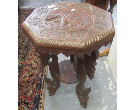 Carved hardwood probably Indian octagonal lamp table with under tier and elephant decoration. (B.P. 21% + VAT) Some minor los