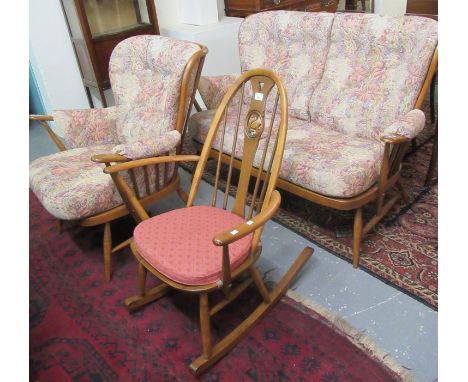 Elm Ercol two piece suite comprising two-seater sofa and armchair, together with a similar Ercol elm hoop-back rocking armcha