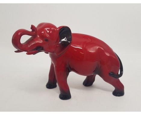 Royal Doulton Flambe model of an elephant with trunk in salute, h: 14cm.