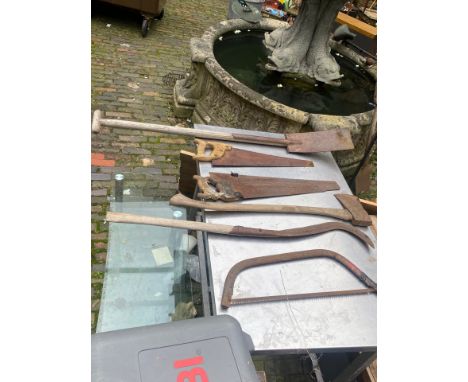 A large collection of garden tools to include axe, shovels, brushes, bush trimmer etc