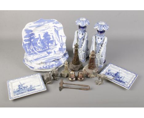 A mixed lot of collectables including Spode plates, peter kangaroo, silver plate tongs, Cornish lighthouse paperweights, blue