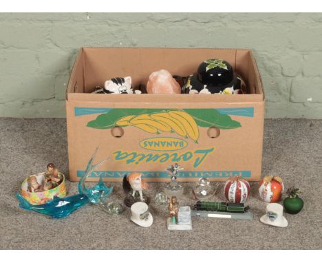 One box of miscellaneous items. To include dolls, ceramic apple paperweights, glass dolphins, lidded ginger jar, continental 