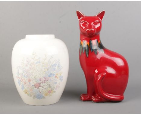 Two pieces of Poole Pottery to include figure of a cat in the Red Delphis pattern (Right) and cream vase with central floral 