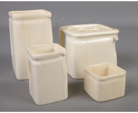 A cubic ceramic tea set made for the 'Cunard Steam Ship Co LTD' by Clews &amp; Co Ltd Tunstall. Consisting of teapot, two jug