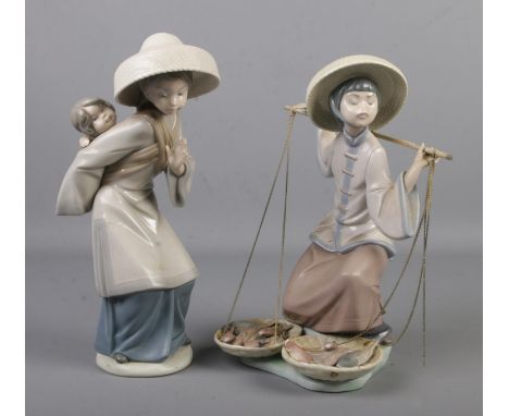 Two Lladro ceramic figures; Fish a Plenty and My Precious Bundle.  Two chains on basket broken.