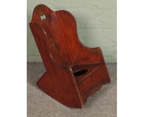 A 19th century child rocking commode chair.  