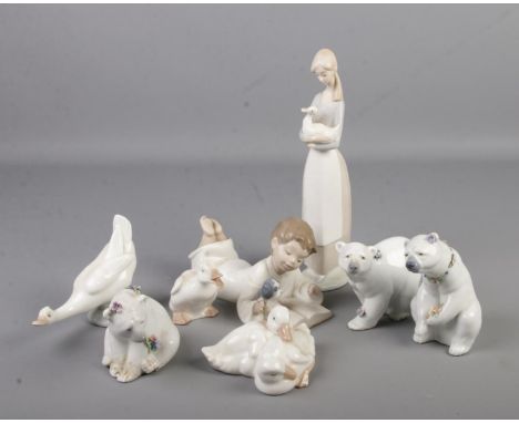 A collection of Lladro and Nao figures. Includes three Lladro polar bears.  