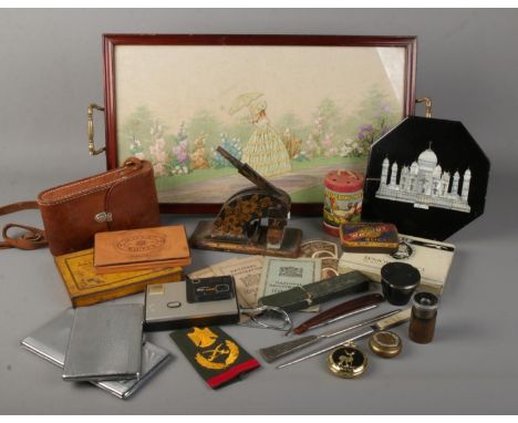 A box of collectables. Includes embroided tray, Kodak autographic brownie No.2, vintage tins, cigarette cases, cut throat raz