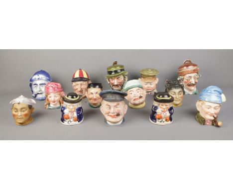 Fourteen assorted ceramic tobacco jars, including oriental, cigar smoking and Majolica style examples.  