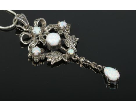 A belle-epoque style silver pendant droplet necklace set with large opal stones and marcasite, mounted on silver chain. Total