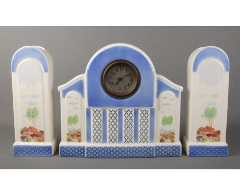 An Art Deco ceramic clock garniture.  