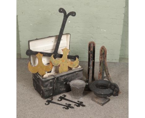 A mixed assortment of metalwares, including tin trunk, cast iron brackets, urn etc.  