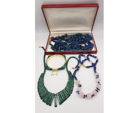 A collection of malachite and lapis jewellery, including a suite of three malachite and lapis pebble bead necklaces and match
