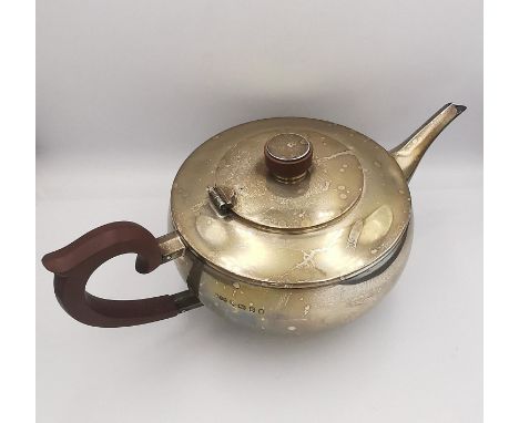 An Art Deco silver teapot with Bakelite handle and finial. Hallmarked: H&amp;H for Hukin &amp; Heath Ltd, Birmingham, 1935. L