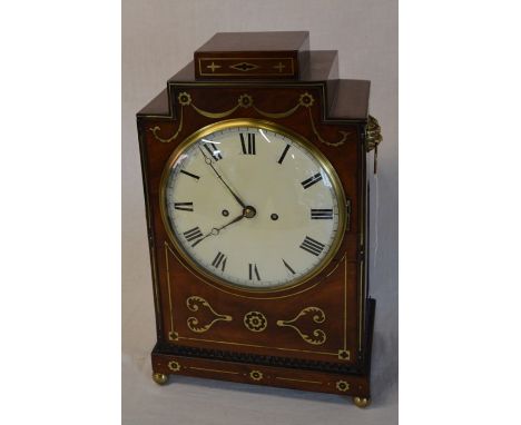 Regency mahogany &amp; brass inlaid mantel clock with back plate engraved John Spyere London, lion mask ring handles, fish sc