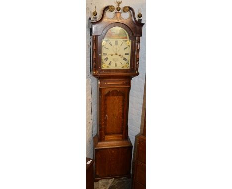 Victorian 8 day longcase clock with painted dial by R H Bryan Lincoln in an oak case with mixed wood veneer, swan neck pedime