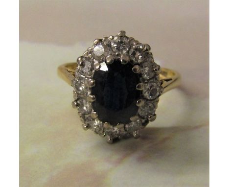 18ct gold sapphire and diamond oval cluster ring (sapphire approximately 1.4 ct, diamond total 0.54 ct) size L/M