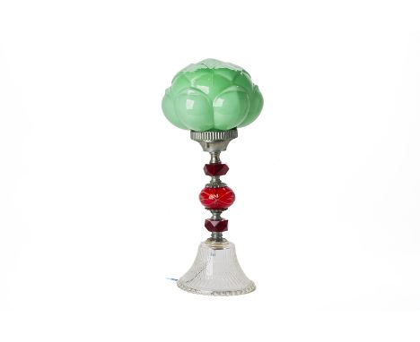 A GLASS TABLE LAMP
With moulded glass green shade and multicoloured glass stem
41cm high
Condition: CR
In working condition a