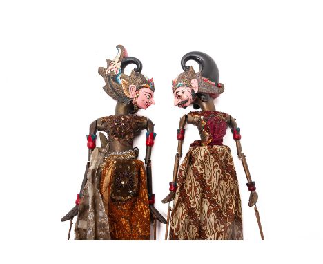 TWO VINTAGE WAYANG GOLEK PUPPETS
West Java, Indonesia
With typical fabric and beaded clothing, the carved wood heads both pai