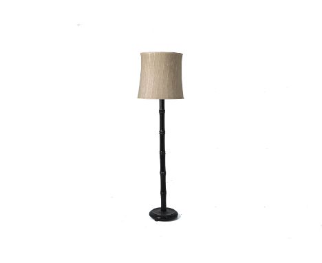 A BLACK LACQUERED BAMBOO STYLE STANDING LAMP
With shade, in working condition
164cm tall
Condition: Condition Report
In worki