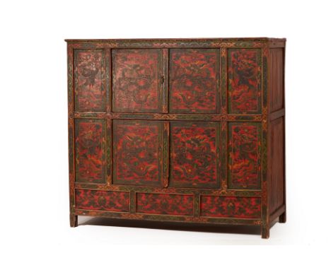 A TIBETAN PAINTED CABINET
The panelled front decorated with dragons and phoenixes
127cm high x 139cm long x 60cm deep
Conditi