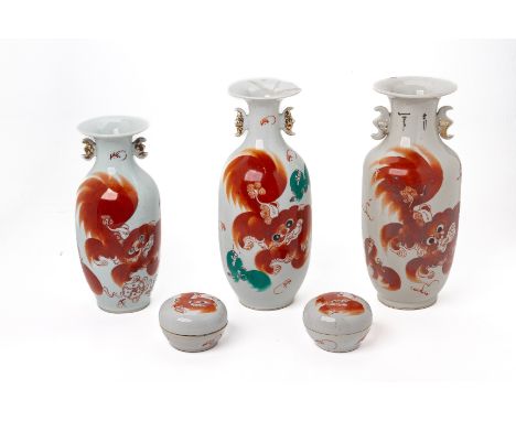 THREE CHINESE IRON RED PORCELAIN VASES
Three double earred vases decorated with lions and calligraphy, together with two iron