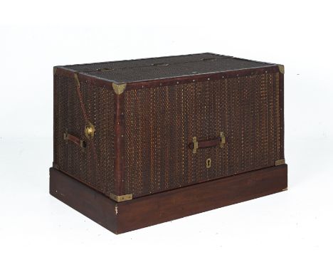 A FOLDABLE CAMPBED TRUNK
Metal bound with rattan covered exterior, with leather handles and opening to form a camp bed
106 (W
