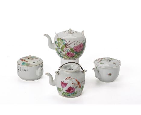 A GROUP OF FAMILLE ROSE PORCELAIN TEAPOTS
Decorated with birds amongst flowering foliage
Tallest item 10cm high
Condition: Co