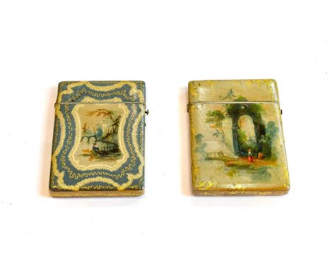 Two Similar Papier Mache Card-Cases, each oblong, with white and pale blue decoration centring a painted landscape on the fro