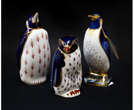 Royal Crown Derby Imari paperweights; Emperor Penguin, Rock Hopper Penguin (certificate) and another penguin, gold stoppers (