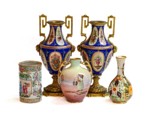 A pair of gilt mounted porcelain urns; a Davenport bottle vase; a Royal Doulton two-handled vase; a Cantonese brushCondition 
