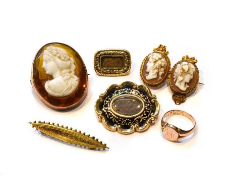 A double cameo brooch, length 3.3cm (a.f.); a hardstone cameo brooch, length 3.1cm; a 9 carat gold signet ring, finger size K